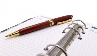 pen and organizer on a white background